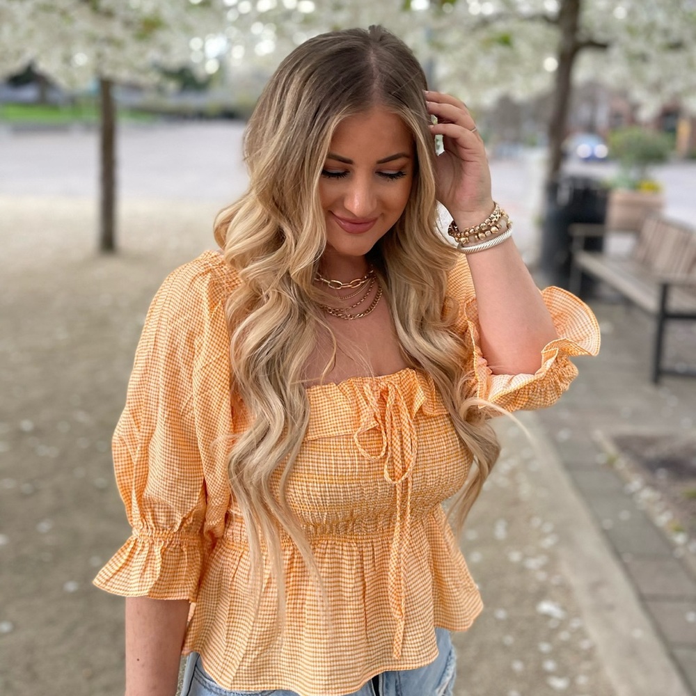 Light orange peplum gingham blouse